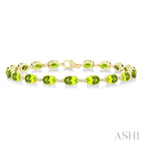6X4 MM Oval Cut Peridot and 1/6 Ctw Round Cut Diamond Semi-Precious Tennis Bracelet in 10K Yellow Gold