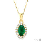 1/20 ctw Round Cut Diamond and 5X3MM Oval Shape Emerald Halo Precious Pendant with Chain in 14K Yellow Gold