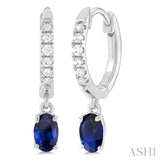 5x3 MM Oval Cut Sapphire and 1/8 Ctw Petite Round Cut Diamond Precious Fashion Huggies in 10K White Gold